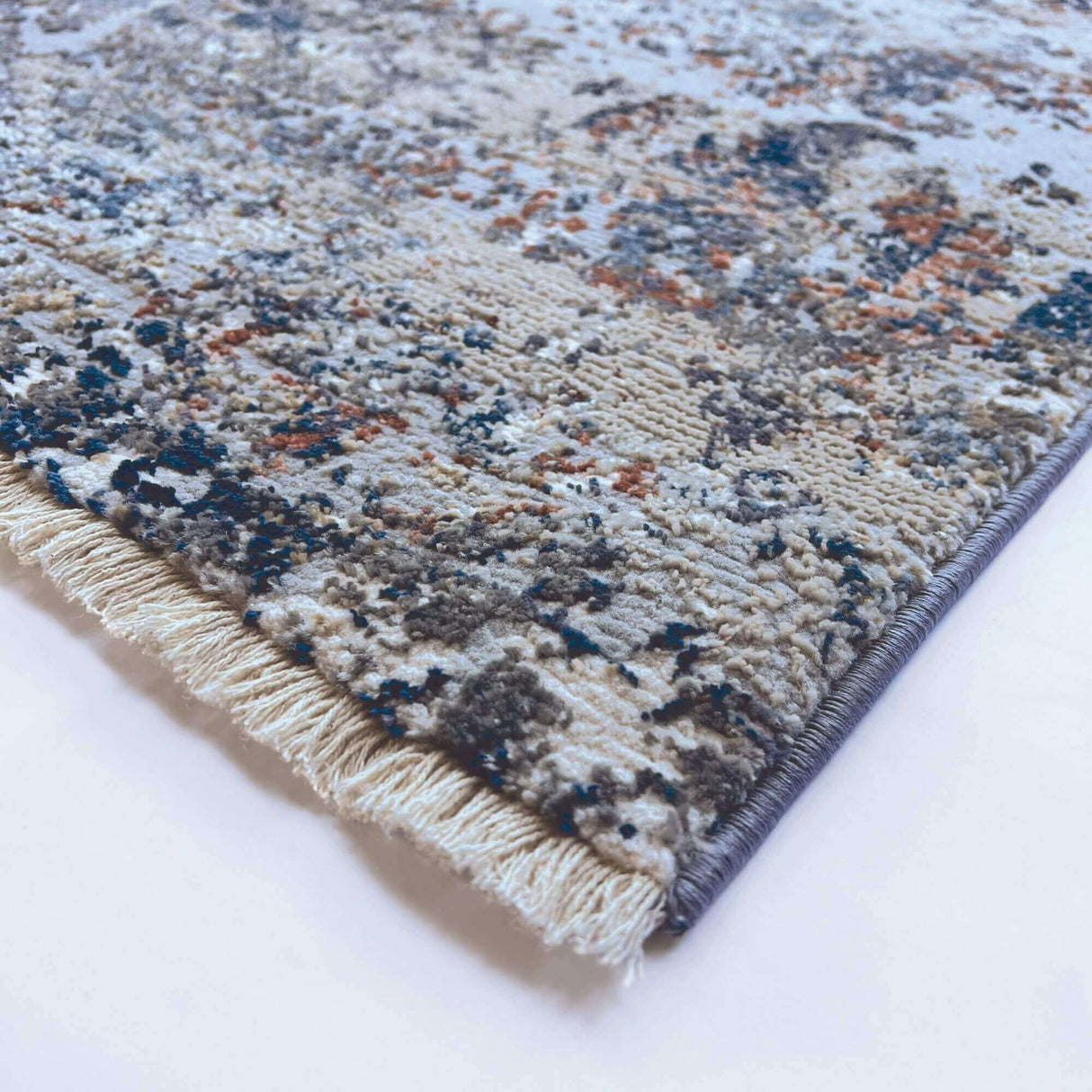 Stylish Abstract Rug featuring intricate patterns in blue and beige tones, perfect for modern interiors