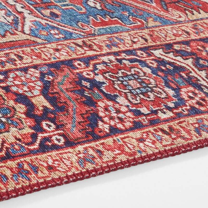 Amata Rug with intricate patterns in deep reds and blues, perfect for enhancing any living space