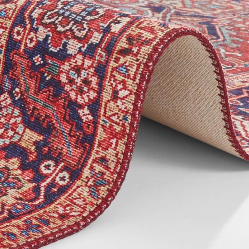 Close-up of Amata Rug with intricate patterns in red and blue tones for stylish home decor