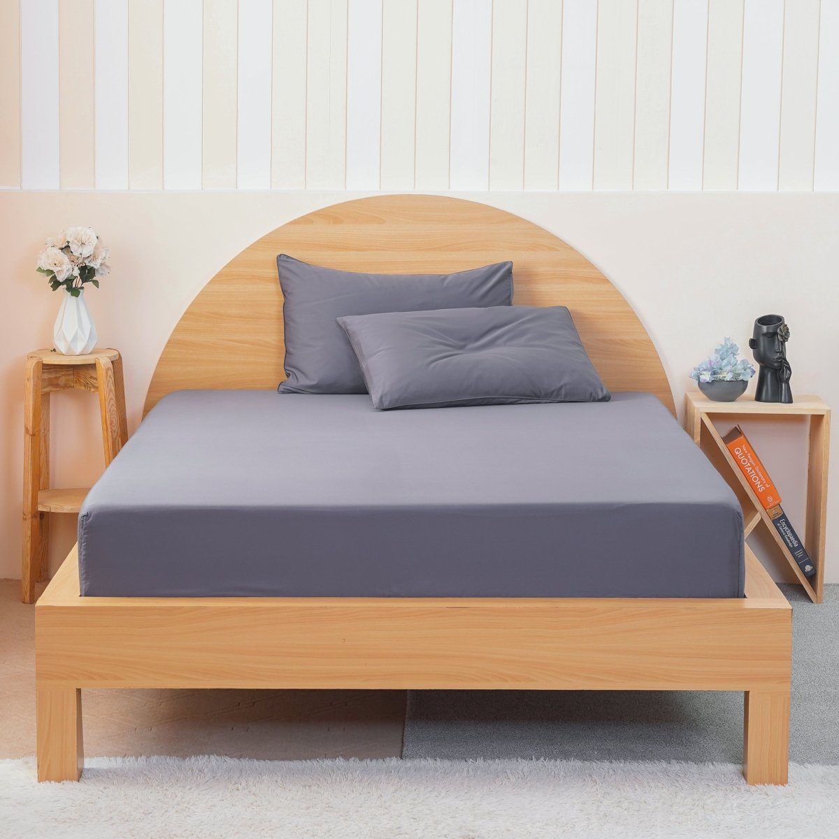 SHEET STORY Fitted Sheet in grey on a wooden bed with matching pillows and minimalist decor
