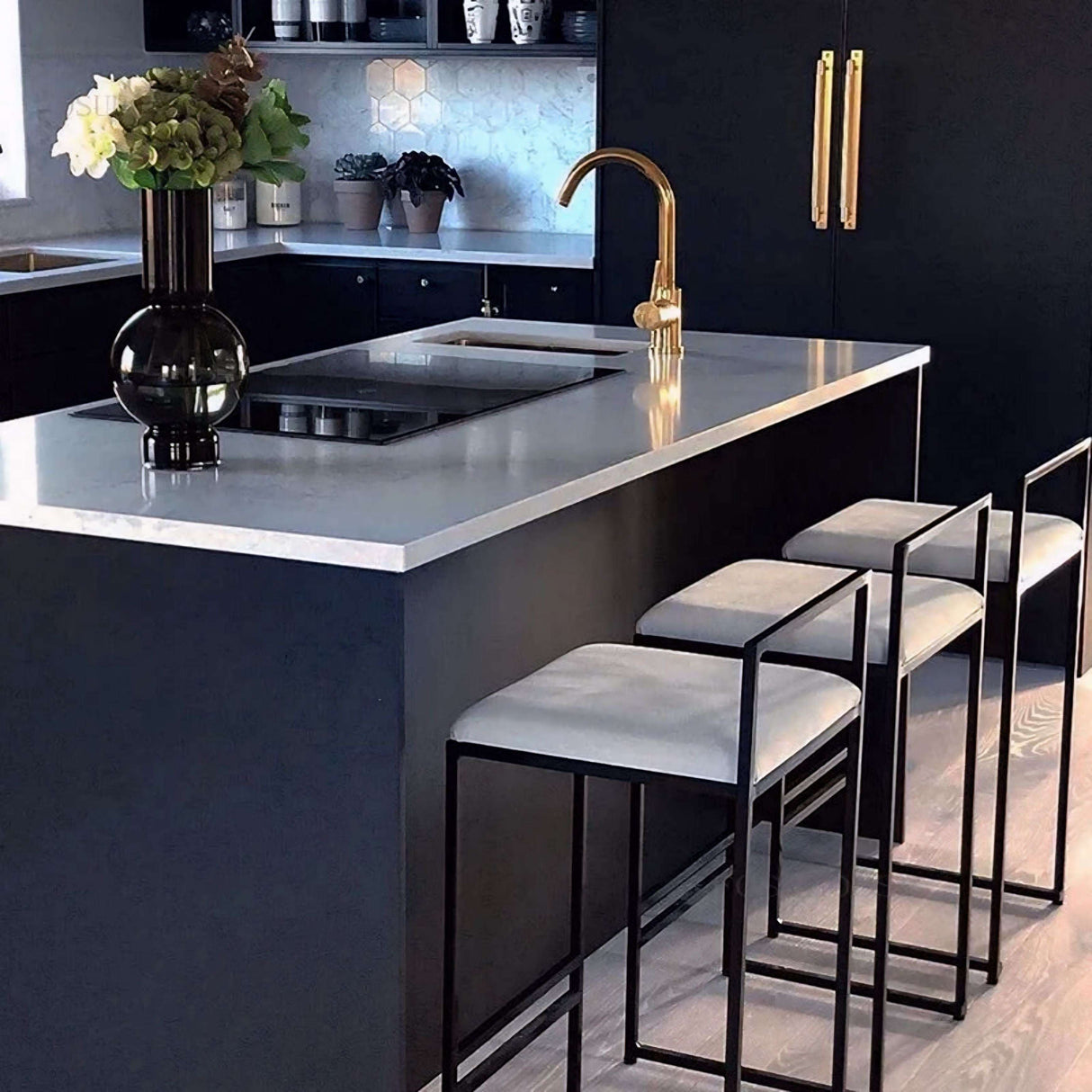 Stylish Nisu Home Bar Stool set at a modern kitchen island with a sleek design