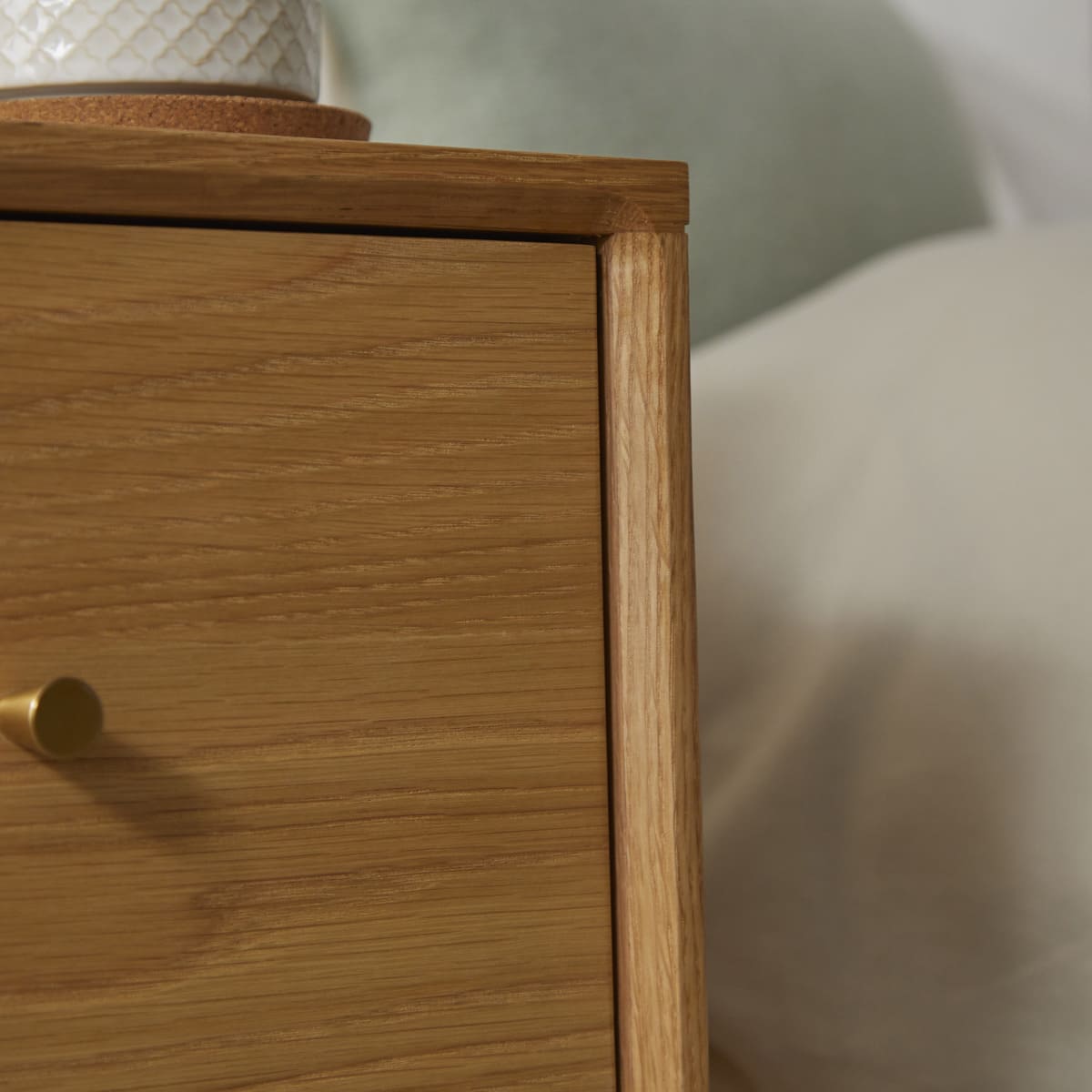 Fishe and Lilly Bedside Table in natural wood finish with a round lamp and smooth drawer