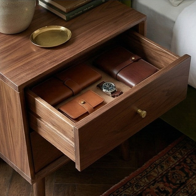 Fishe and Lilly Bedside Table with smooth wood finish and open drawer displaying leather wallets and a watch