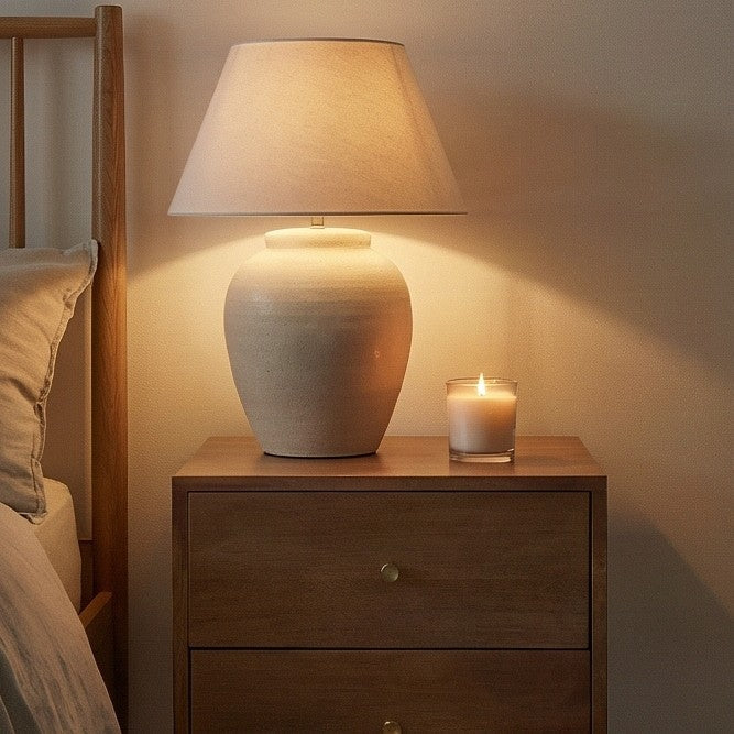 Fishe and Lilly wooden Bedside Table with a decorative lamp and candle for a cosy bedroom ambiance