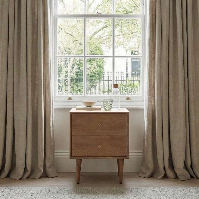 Fishe and Lilly Bedside Table in Natural Wood Beside a Window with Decorative Items