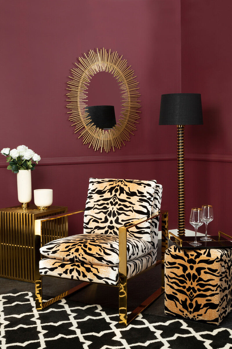 Stylish Black and White Rug under a bold lounge chair in a modern living room setting