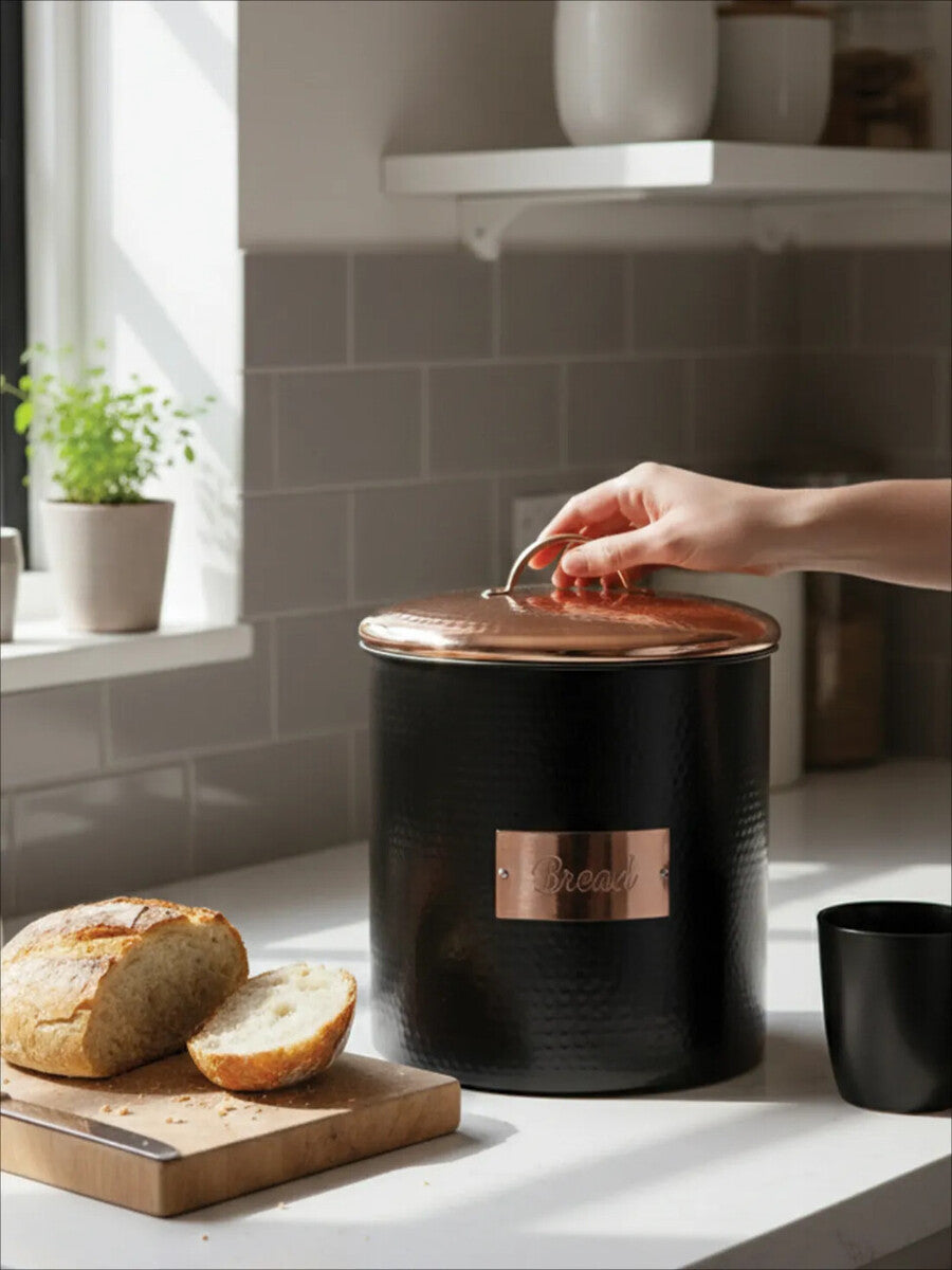 Orsina Bread Bin with a copper lid for stylish storage of fresh bread on kitchen countertop