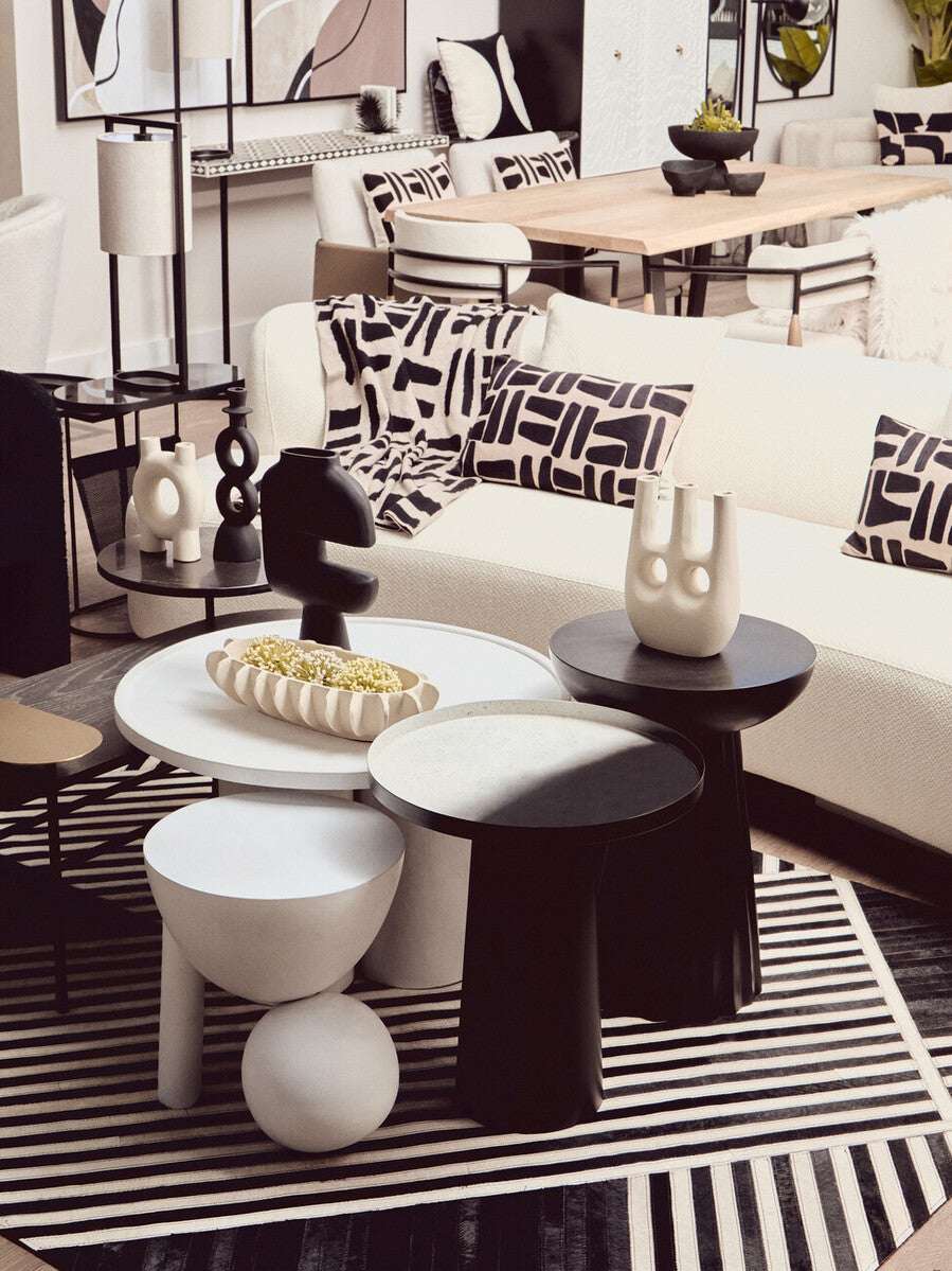 Elegant black throw from Orsina draped over a stylish sofa in a modern living room setting