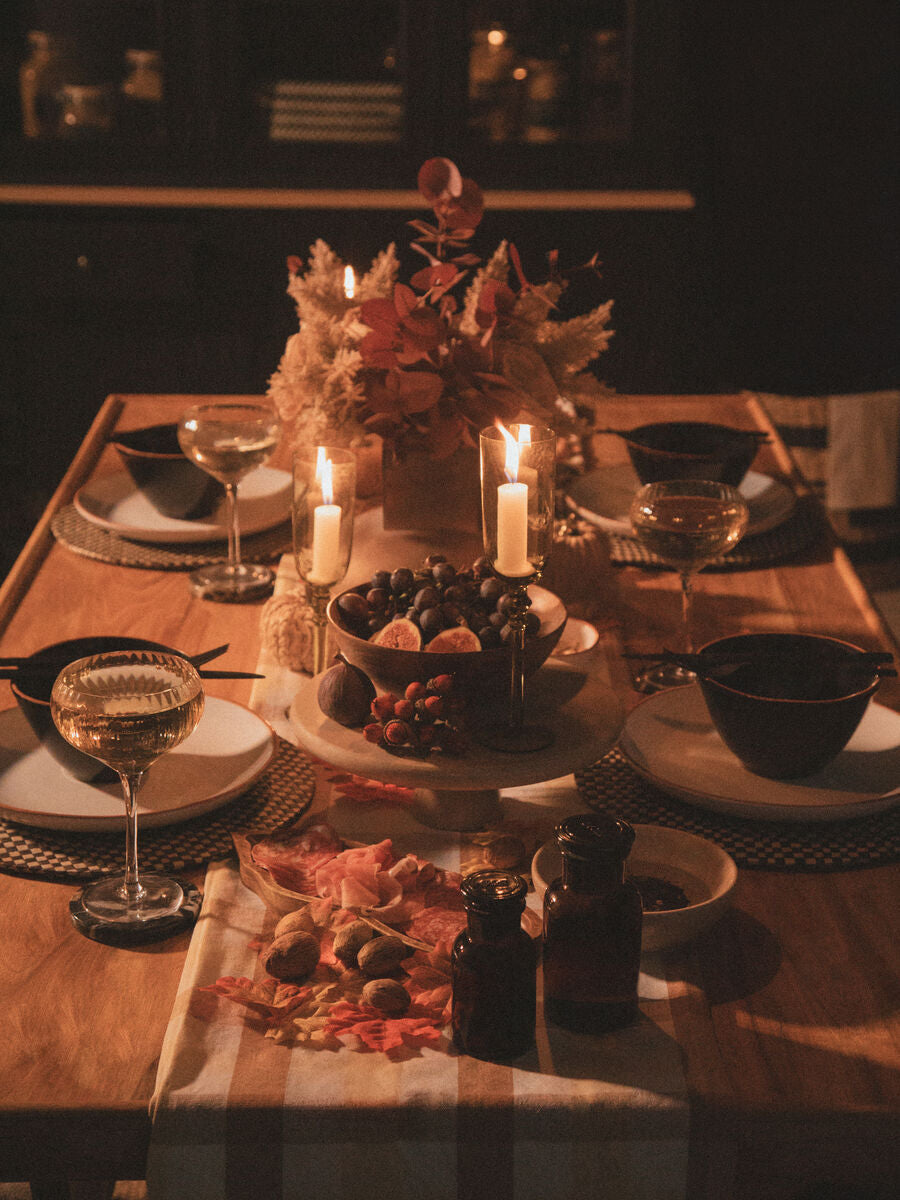 Elegant Orsina Cake Stand displaying a selection of fruits on a beautifully arranged dining table