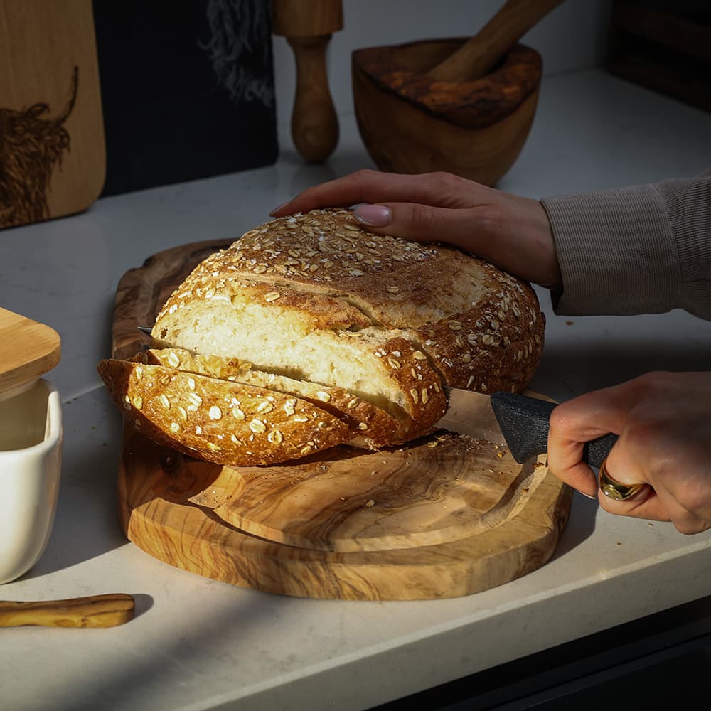 Selbrae House Carving Board made from natural wood, ideal for slicing bread and food preparation