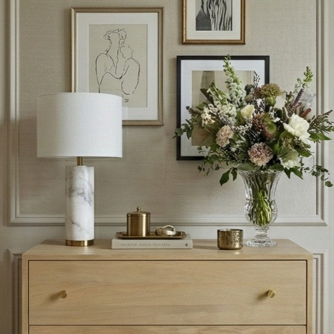 Fishe and Lilly Chest of Drawers with Elegant Table Lamp and Fresh Flower Arrangement on Top