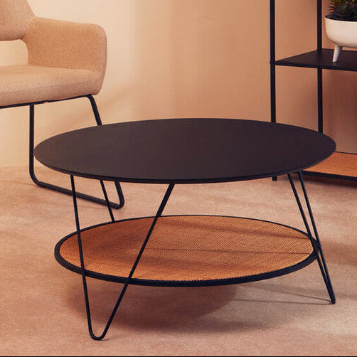 Modern Orsina Coffee Table with a sleek black top and woven lower shelf for stylish living rooms