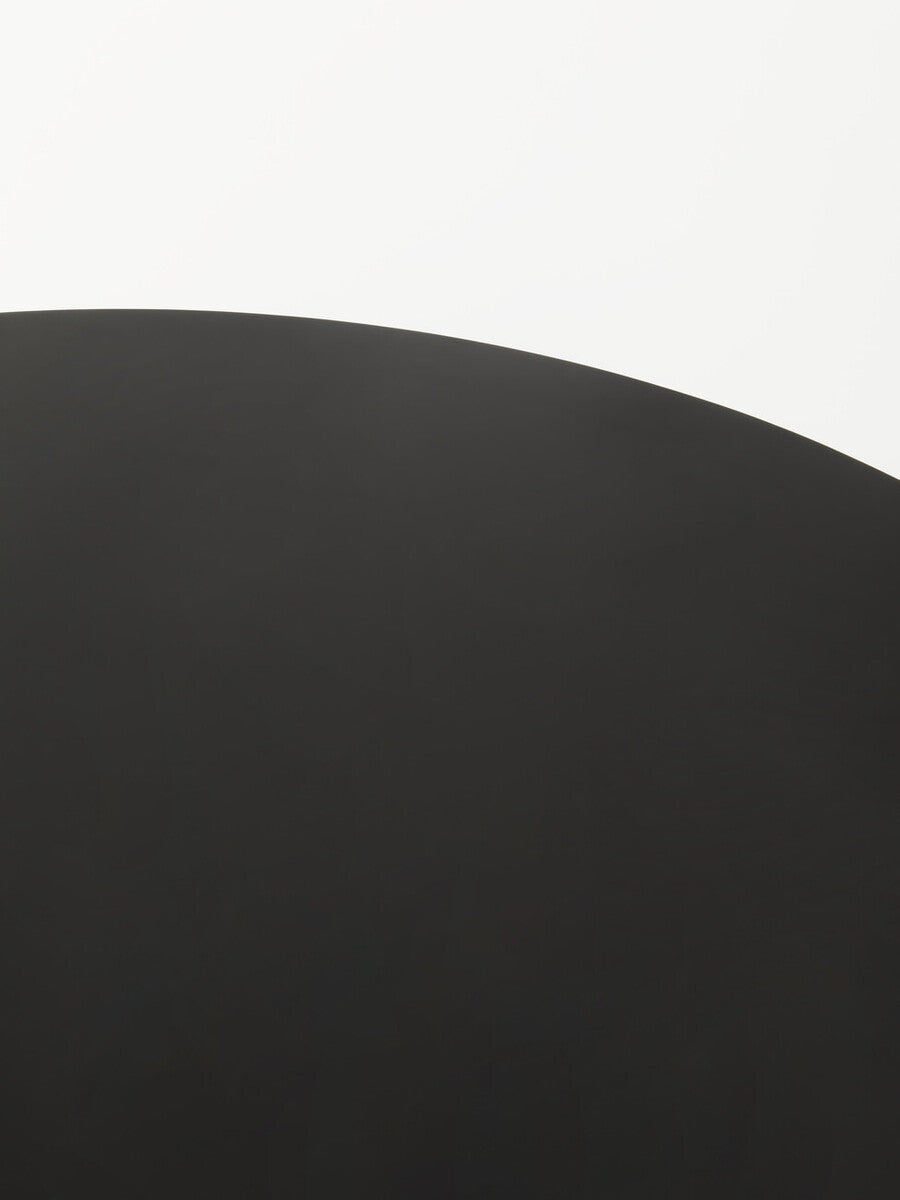 Minimalist Orsina Coffee Table with a sleek black curved surface for contemporary living spaces