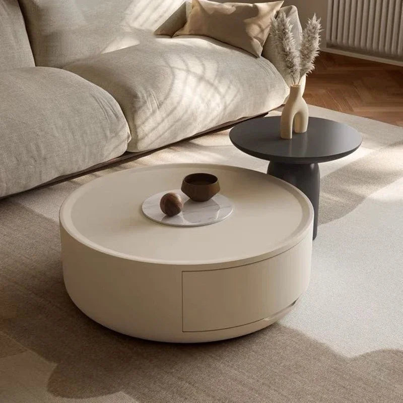 Stylish modern Coffee Table in a soft cream finish, paired with a sleek black side table