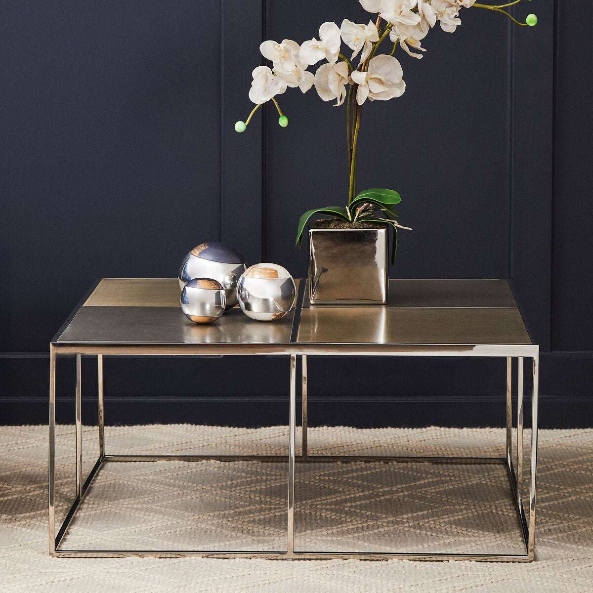 Stylish Orsina Coffee Table with a Metal Frame and Decorative Accessories on Top