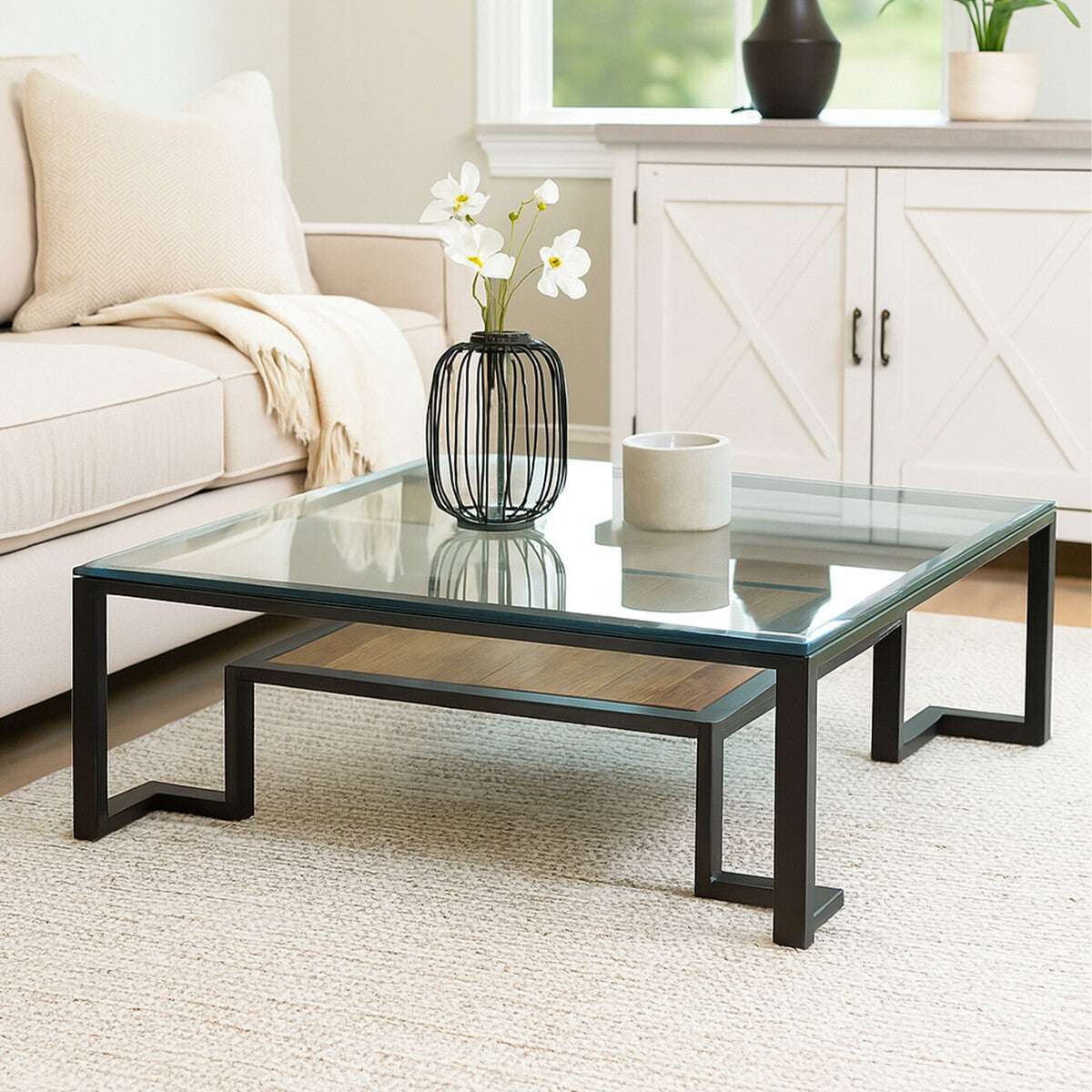 Orsina Coffee Table with a sleek glass top and modern metal legs, perfect for contemporary living rooms