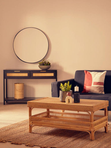 Stylish Orsina Console Table with Rattan Design in a Cozy Living Room Setting