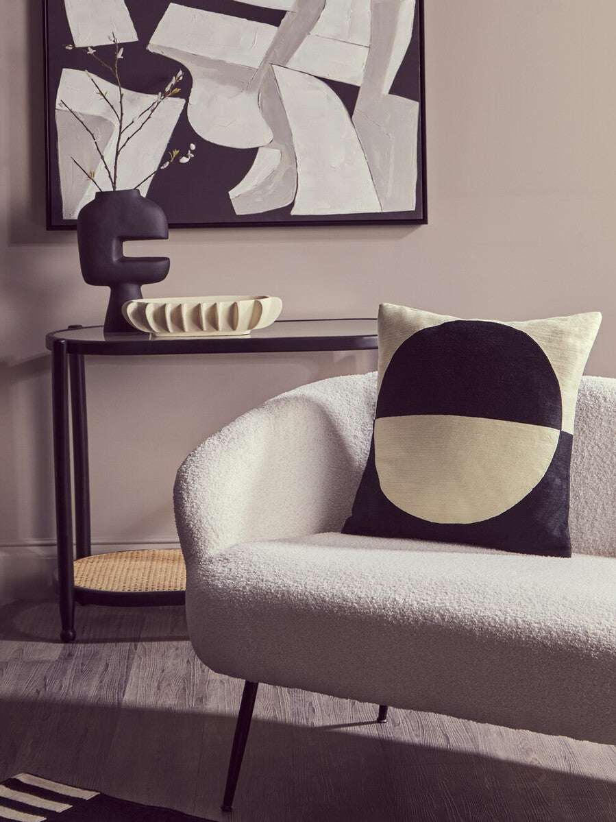 Stylish Orsina Console Table displayed with decorative items and a modern sofa in a chic living room