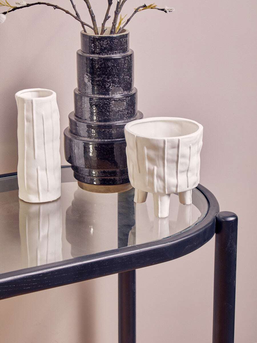 Stylish Orsina Console Table featuring modern decor with white ceramic pots and a sleek design