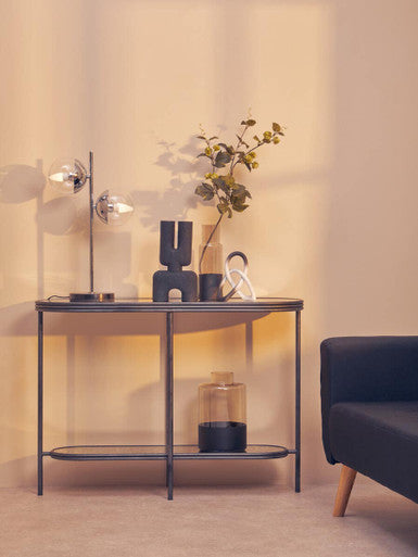 Orsina Console Table with Modern Design, Featuring Decorative Items and Elegant Lighting