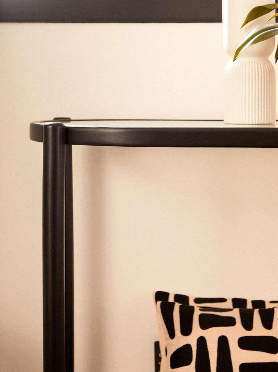 Stylish Orsina Console Table with a sleek black finish and minimalist design
