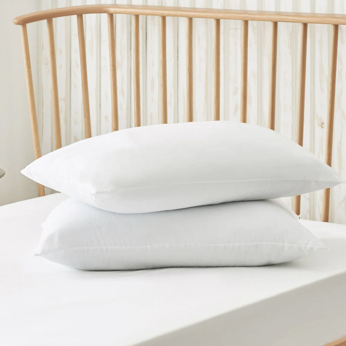 OLIVIA ROCCO Cotton Blend Pillows stacked on a bed for comfort and support