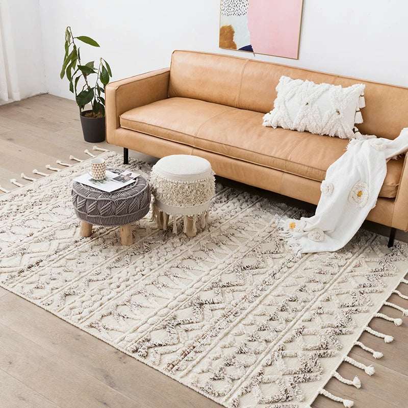 Nisu Home Cotton Rug in a neutral colour, enhancing a stylish living room with a brown sofa and decorative elements