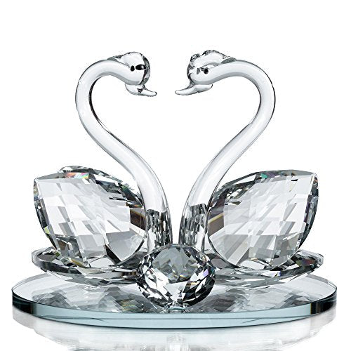 Elegant crystal glass swan figurine featuring two swans with a decorative base from London Boutique Lifestyle
