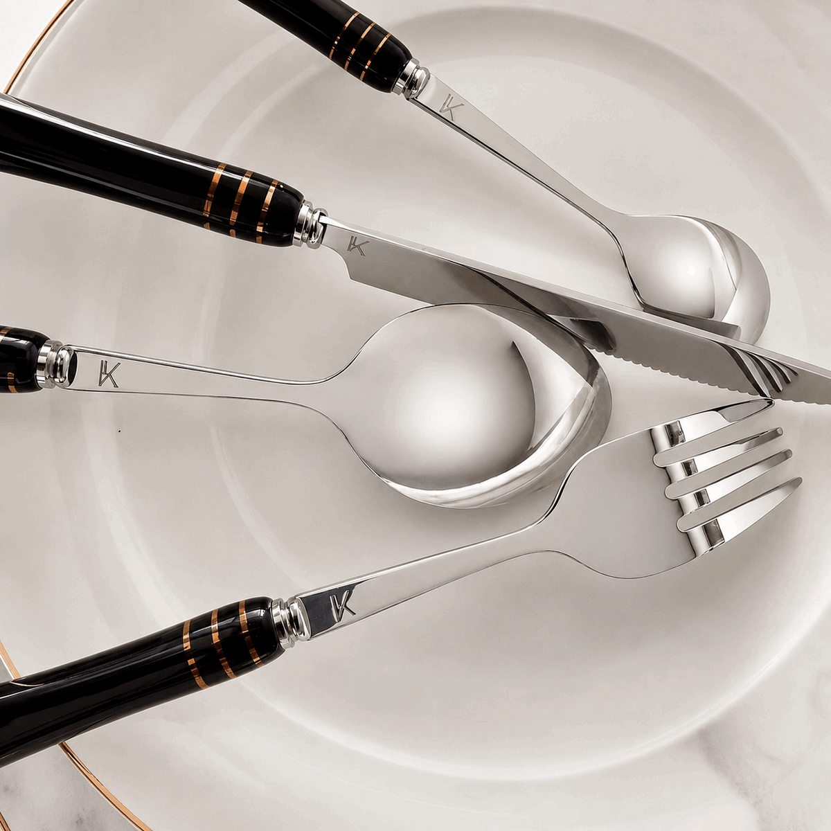 KitchBoom Cutlery Set featuring elegant stainless steel utensils with stylish black handles