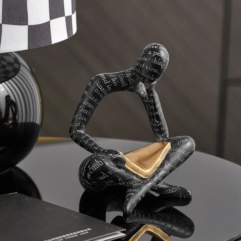 Nisu Home Decorative Black Ornament of a Person Reading with Gold Accents for Modern Interiors