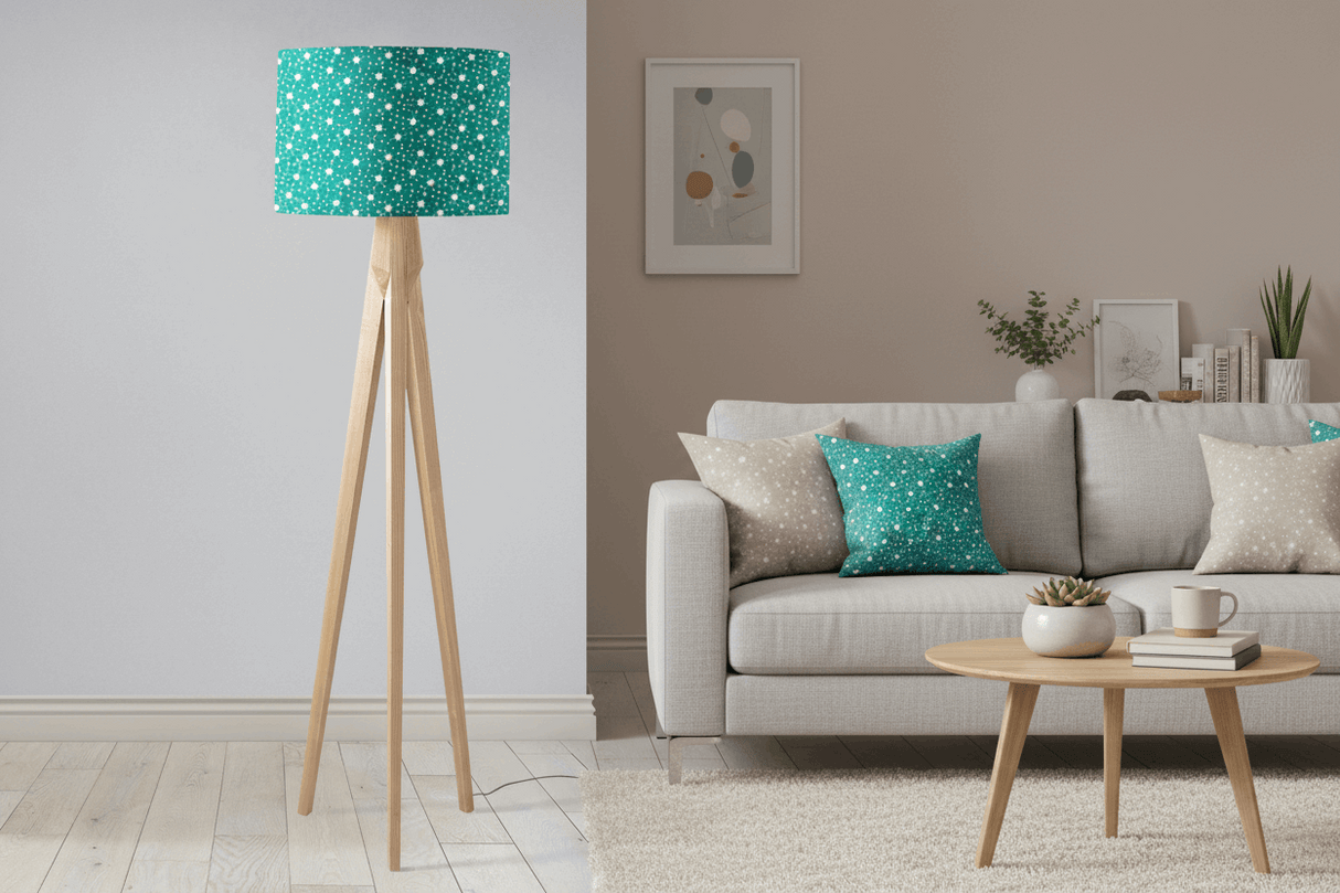 Stylish Shadow Bright lampshade in teal with white polka dots atop a wooden tripod lamp