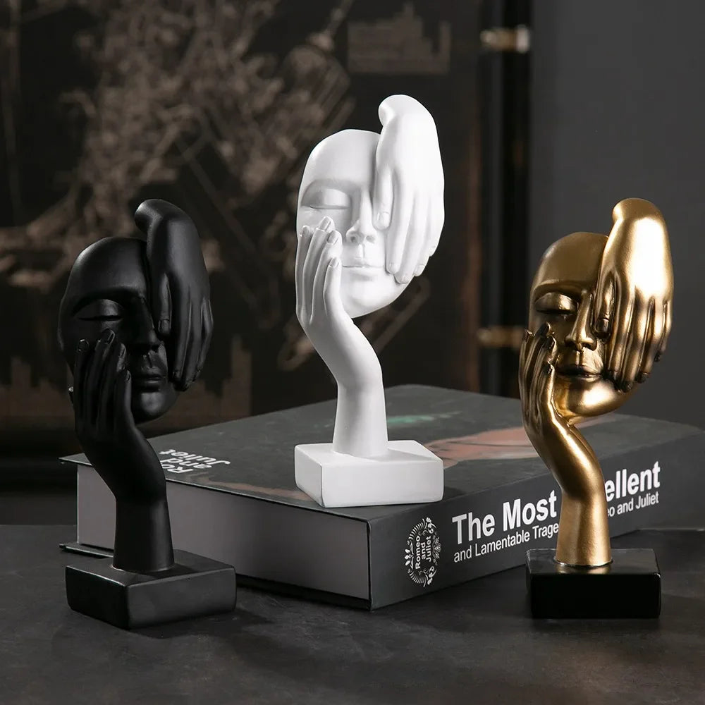 Elegant Nisu Home Ornament set with black, gold, and white human face sculptures