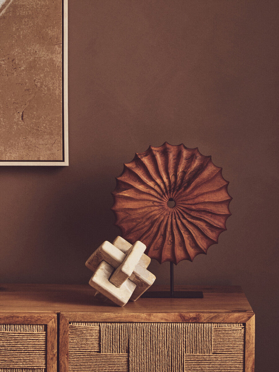 Orsina Sculpture in a modern design with a textured wooden ornament on a decorative table