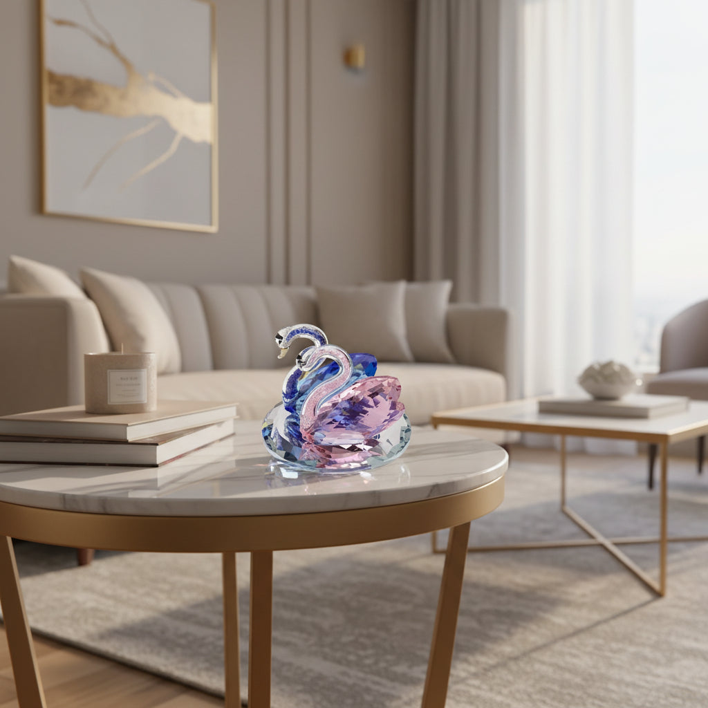 Elegant glass Swan figurine in pink and blue resting on a stylish coffee table