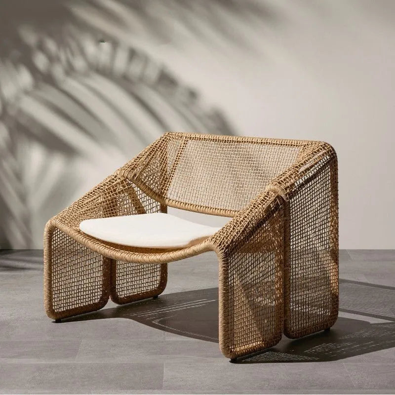 Stylish Nisu Home Dining Chair in woven rattan with a comfortable white seat cushion