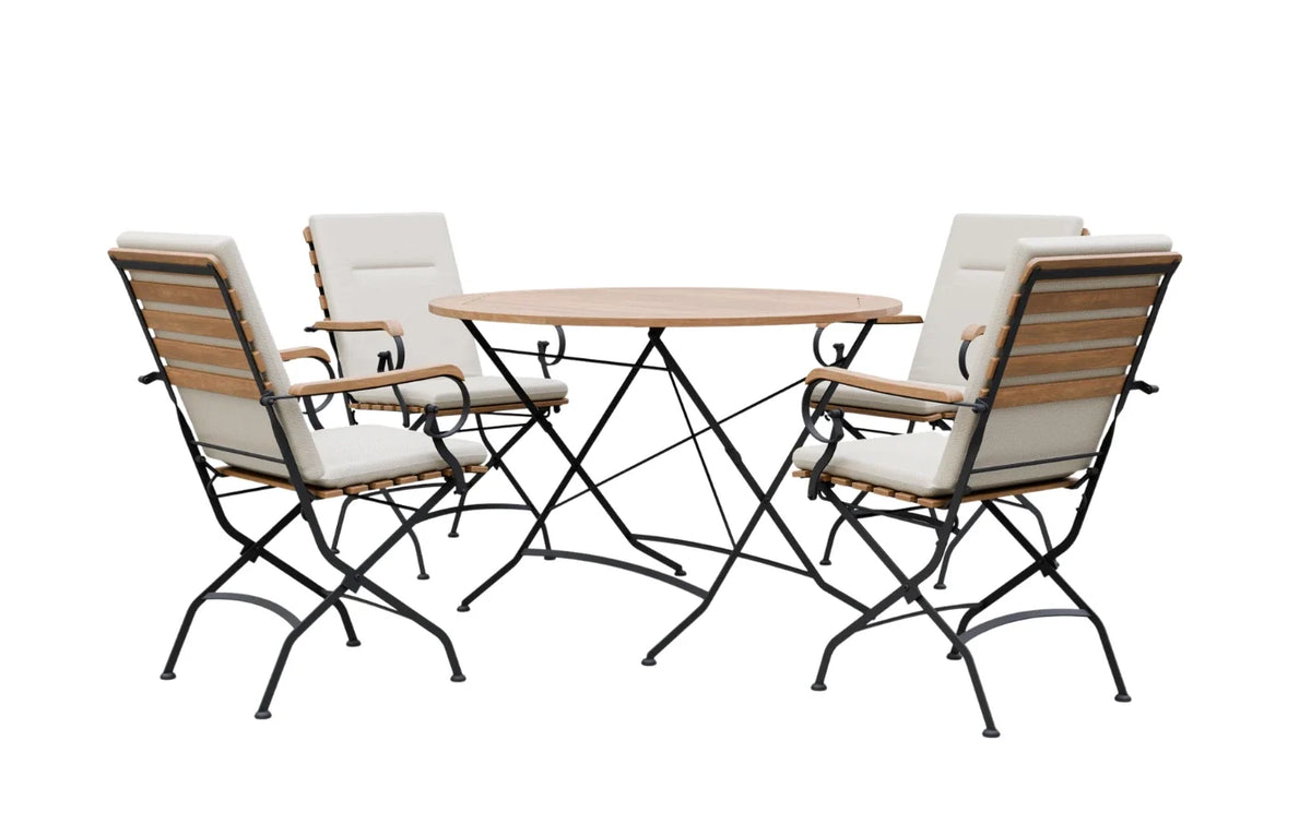 MINT Outdoor Dining Set featuring a round table and four cushioned chairs for outdoor gatherings