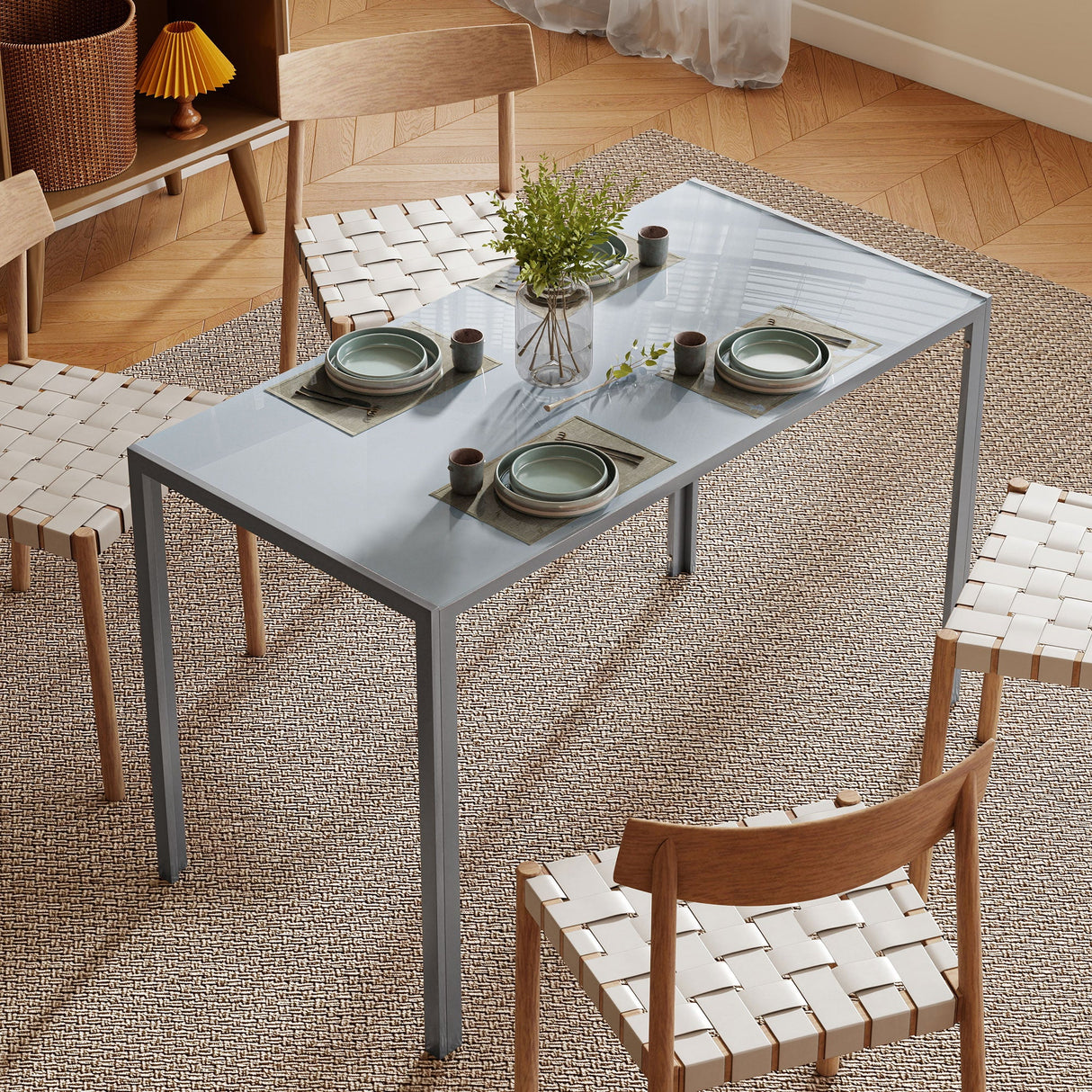 Modern grey Dining Table by Wise Galleria with simple design, styled with plates and greenery