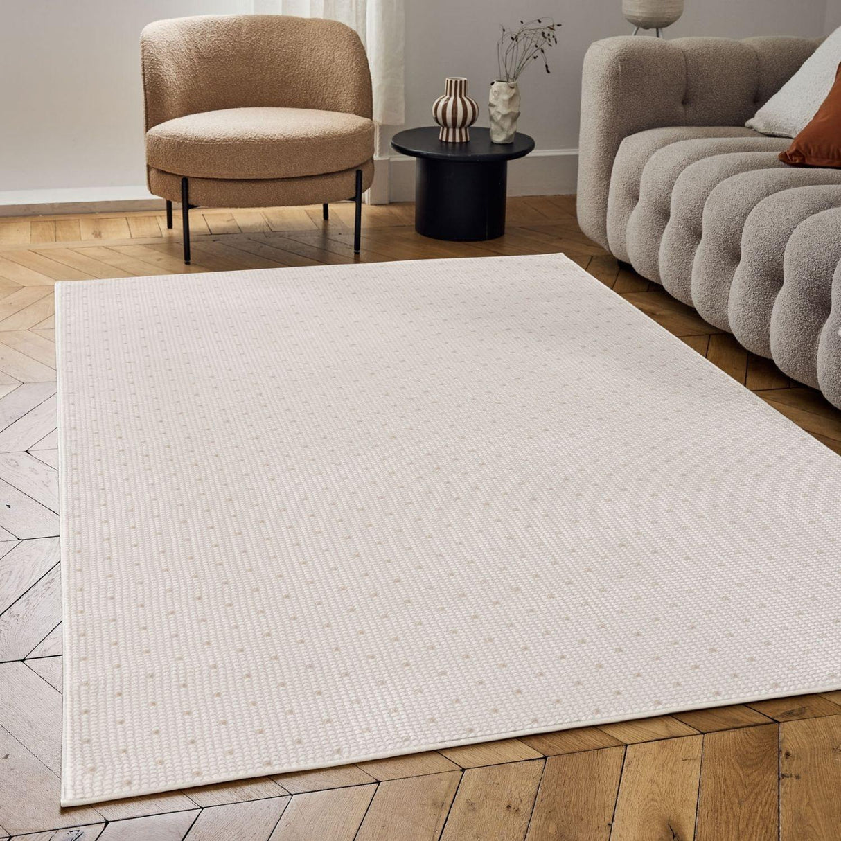 Elegant Dots Rug in soft beige, adding a stylish touch to modern living room decor
