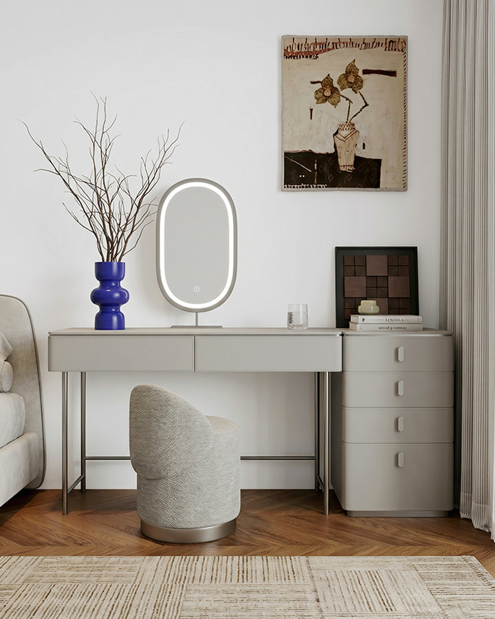 Modern Le Di Vita Dressing Table with Oval Mirror and Stylish Accessories in a Chic Living Space