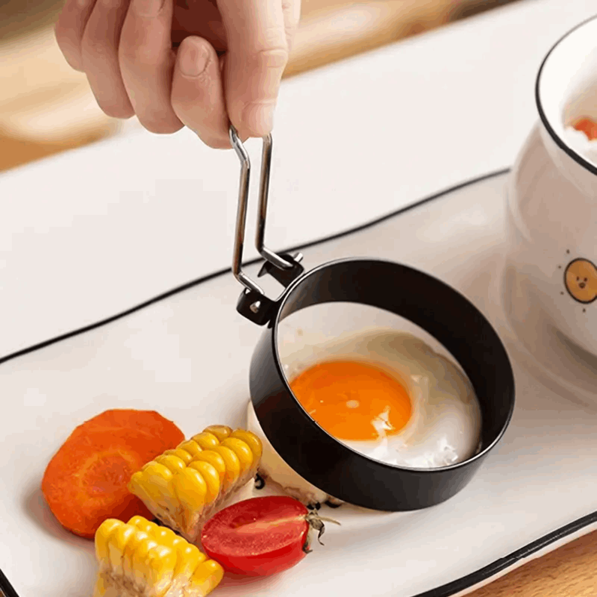 Orsina Egg Rings for perfectly shaped fried eggs, includes a handle and suitable for breakfast meals