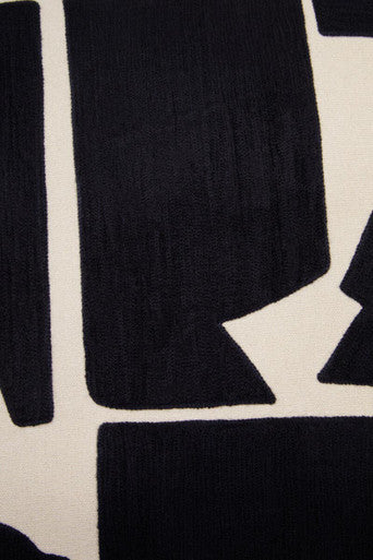 Orsina Floor Cushion with a Modern Abstract Pattern in Black and White for Stylish Comfort