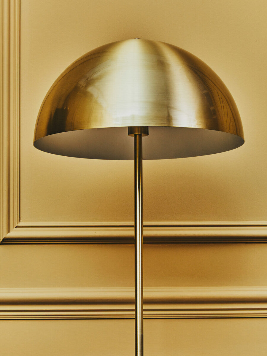Orsina Floor Lamp with a sleek gold dome shade, perfect for modern interior spaces