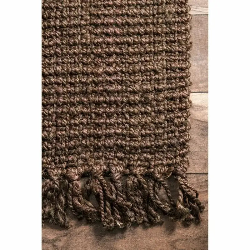 Textured brown Nisu Home Floor Rug with decorative fringes for a cosy home aesthetic