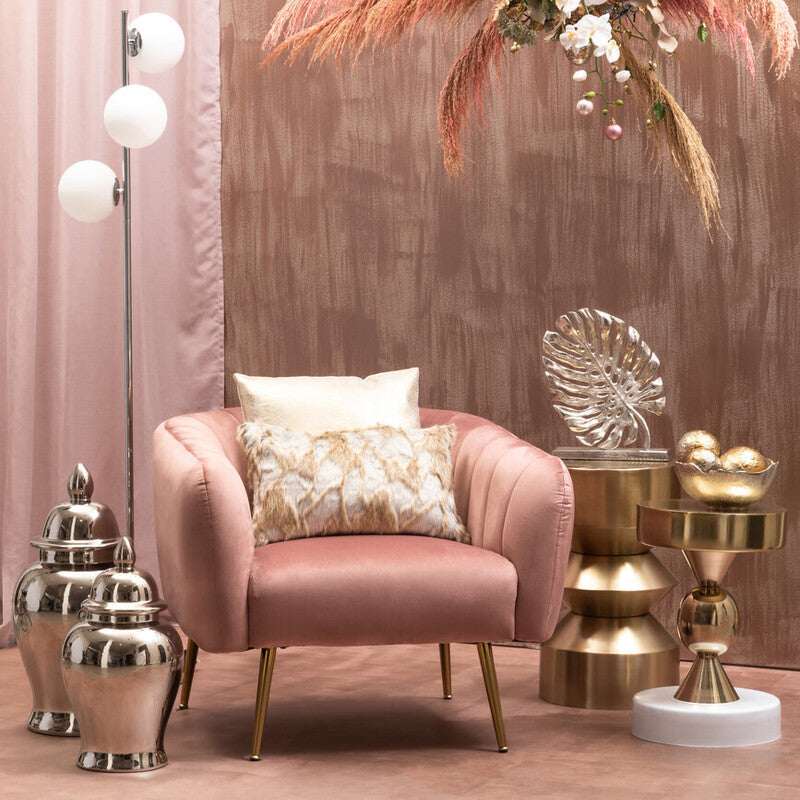 Orsina Fur Cushion on a stylish blush armchair in an elegant interior setting
