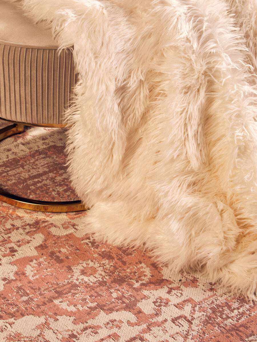 Orsina Fur Throw in Cream Colour Draped Over a Chair for Cozy Home Decor