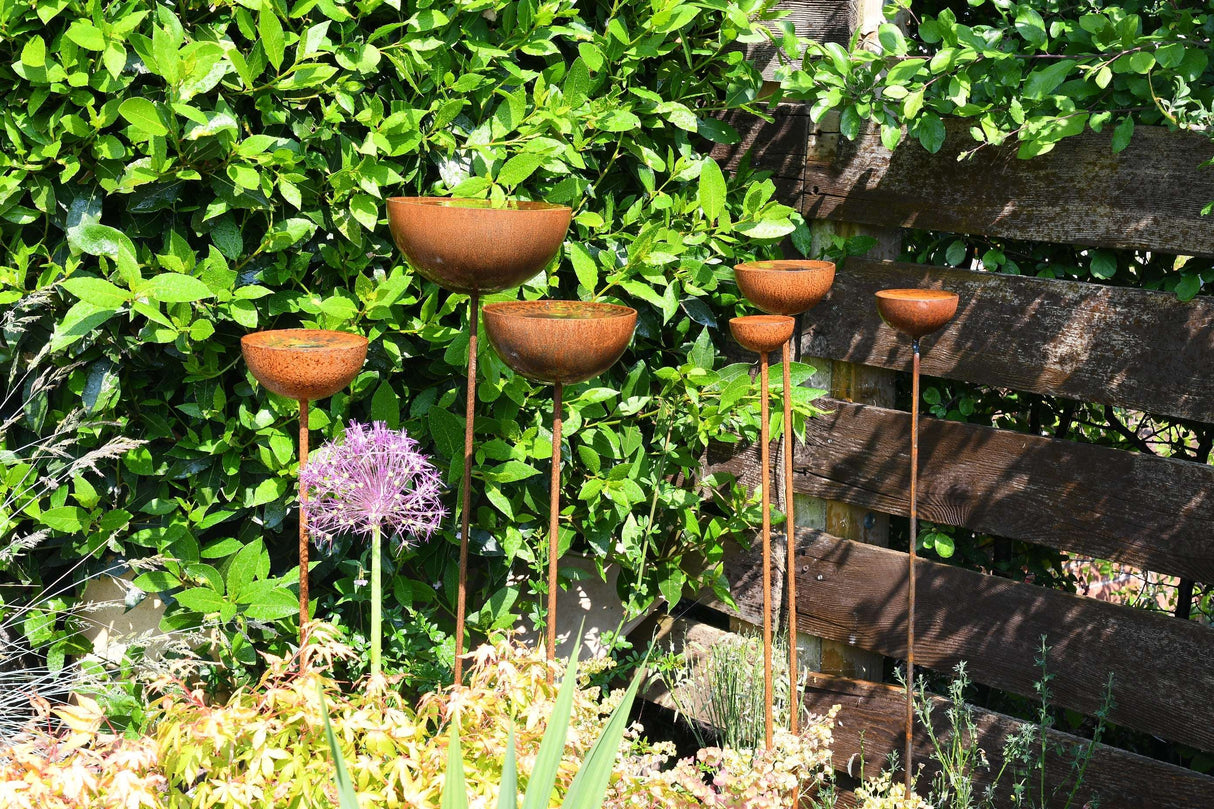 Stylish garden Rain Catcher with multiple bowls on stands for elegant water collection