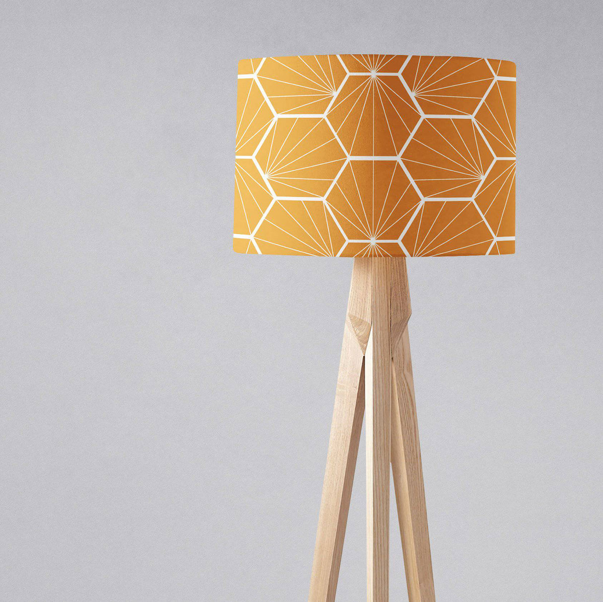 Shadow bright geometric yellow lampshade on a wooden floor lamp for stylish interior lighting