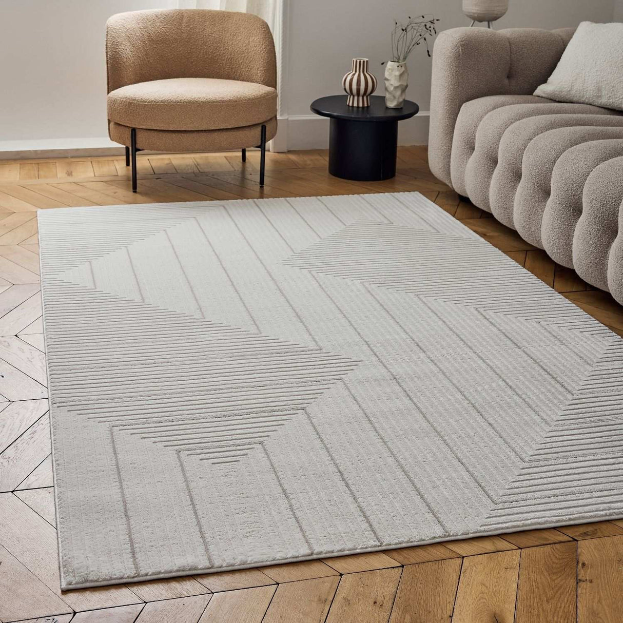 Stylish geometric rug in soft cream with textured patterns, perfect for modern living spaces