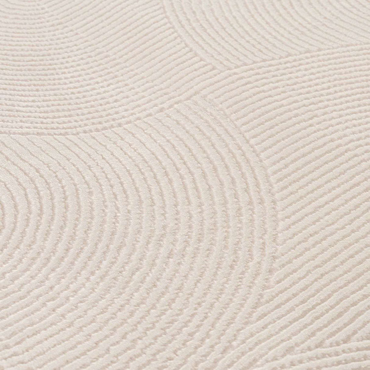 Soft textured geometric rug in light colour with circular patterns for stylish home decor