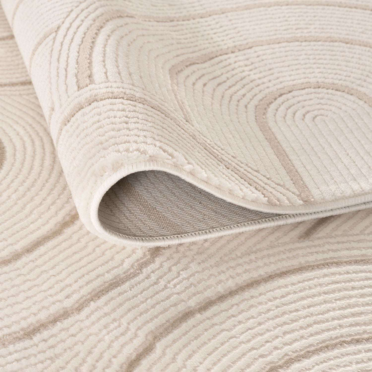 Close-up of a soft Geometric Rug featuring a modern design in neutral tones